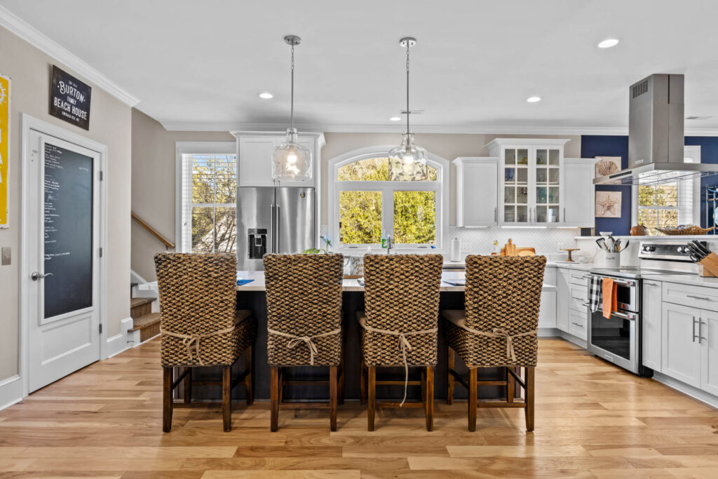 A spacious and brightly-illuminated dining room with outdoor views.